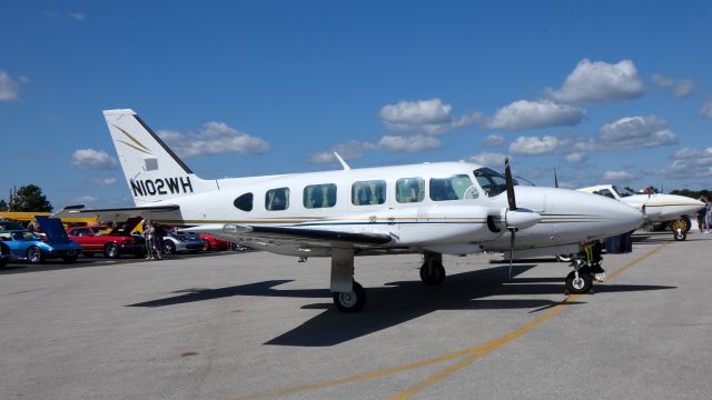 Piper Navajo (N102WH) - Catching some display time is this Piper Navajo Chieftain PA-31-350 in the Summer of 2019 on this "Wings and Wheels" airport celebration.