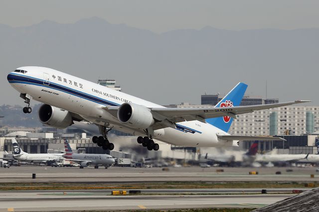 BOEING 777-200LR (B-2010) - Takes off. 