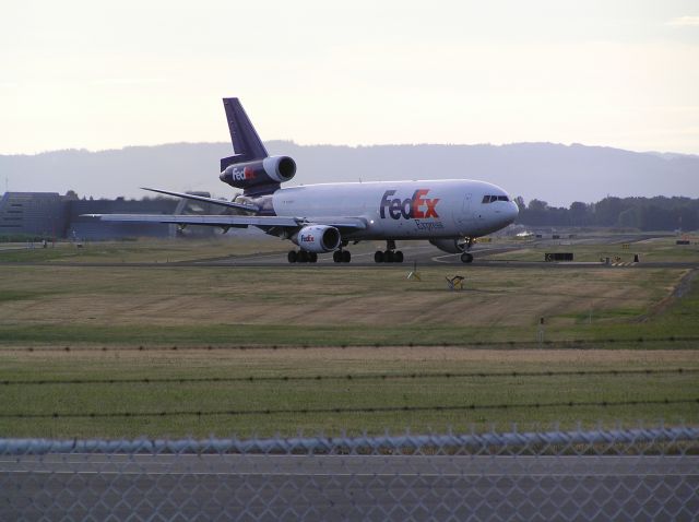 McDonnell Douglas DC-10 (N308FE) - Approach end, 28L