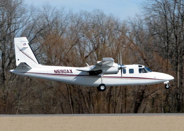 Rockwell Turbo Commander 690 (N690AX) - About to touch down on runway 14 at Shreveports Downtown Airport.