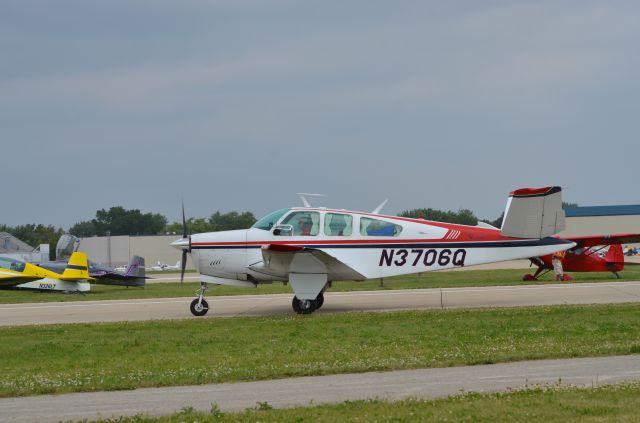 Beechcraft 35 Bonanza (N3706Q) - Bonanza Mass Arrival at Oshkosh AirVenture 2014.