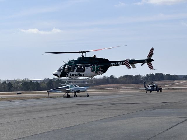 Bell 407 (N135AM) - LifeNet Air 1 taking off for a scene MEDEVAC.