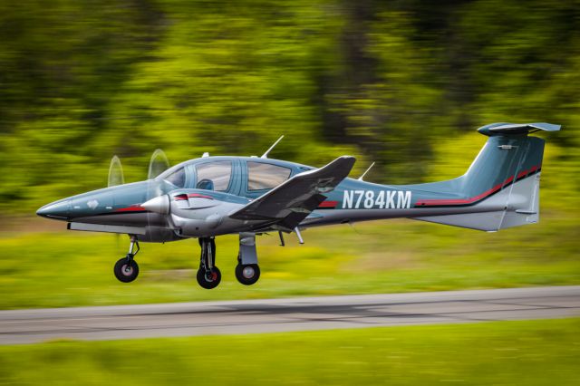 Diamond DA-62 (N784KM) - Panning shot of Diamond DA-62 just getting off the ground at KLOM (Wings Field)br /br /1/100 sec. f/16 500mm ISO 220