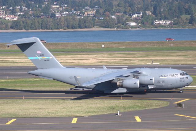 — — - A C-17A Globemaster III taxiing from the reserve ramp to FlightCraft, the FBO at PDX.