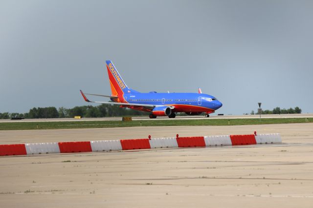 Boeing 737-700 (N461WN) - 041412 SWA taxiing out on A1 to Rwy 19R by the UPS ramp