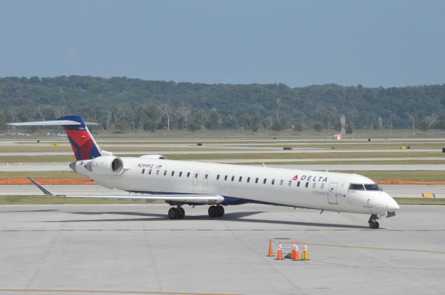 Canadair Regional Jet CRJ-900 (N299PQ) - Delta (Flagship) 3501 pushed back at Omaha for departure out to Detroit Metro International 2 hours delayed.  Taken August 11, 2016 with Nikon D3200 mounting 55-200mm lens.  