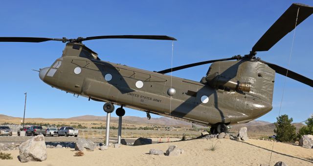 Boeing CH-47 Chinook (9000200) - A CH-47 Chinook, painted to resemble Nevada Army Air Guard Chinook 90-00200 (Call: "Mustang Two Two"), as it looked on 25 Sep 2005, is mounted on sticks and on display at the NevArmy AG Base at KRTS.br /This static display will be dedicated one week from today, on 25 Sep 2024, exactly 19 years to the day that the real "Mustang Two Two" (90-00200) made its Final Descent while leading a military sortie in Afghanistan. "Mustang Two Two' was hit by an RPG and went down in Zabul Province, Afghanistan. All five Army National Guard personnel, members of Company "D," 113th Aviation Battalion, lost their lives and all were posthumously awarded Bronze Stars, Purple Hearts, and Air Medals.br /br /CWO John Flynn, Reno, Nevadabr /WO1 Adrian Stump, Pendleton, Oregonbr /Sgt Patrick Stewart, Reno, Nevadabr /Sgt Tane Baum, Pendleton, Oregonbr /Sgt Kenneth Ross, Columbus, Ohiobr /We gratefully acknowledge your service and the sacrifice you have all made for our country. Please Rest in Honored Peace.