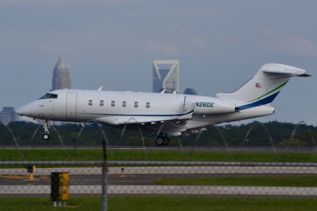 Bombardier Challenger 300 (N26DE) - WELLS FARGO TRUST CO NA TRUSTEE (Duke Energy) departing KCLT with HQ building (right) in the background - 10/14/18