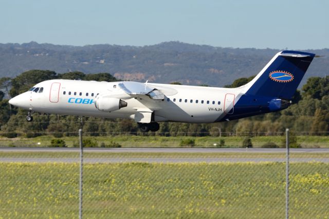 Avro RJ-100 Avroliner (VH-NJH) - About to put down on runway 05. Tuesday 22nd July 2014.