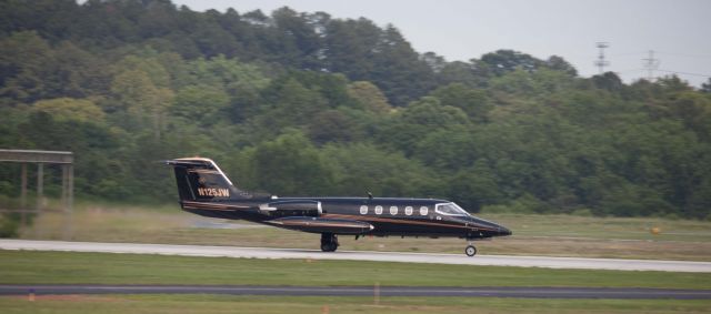 Learjet 25 (N125JW) - At the transition from land to air.