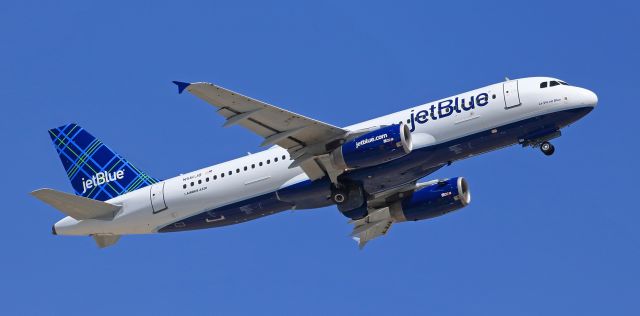 Airbus A320 (N561JB) - JBUs "La Vie en Blue" (N561JB, an A320) climbs into a clear blue mid-afternoon sky as it takes off from RTIAs runway 16R headed to Long Beach to launch jetBlues new RNO-LGB service.