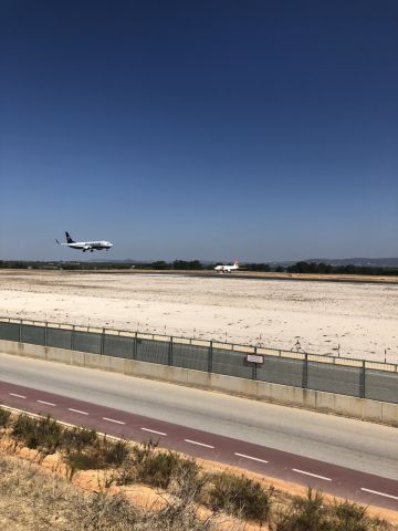 Boeing 737-800 — - standing on a hill between the runway and the sea is behind me