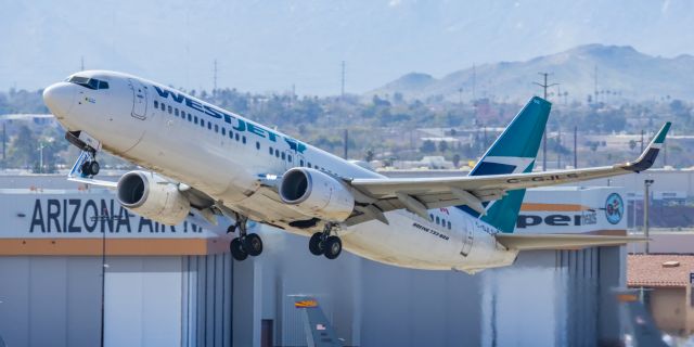 Boeing 737-800 (C-GJLS) - A WestJet 737-800 taking off from PHX on 2/11/23 during the Super Bowl rush. Taken with a Canon R7 and Canon EF 100-400 II L lens.