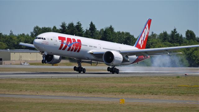 BOEING 777-300 (PT-MUI) - BOE944 touches down on Rwy 34L to complete a flight test on 7.25.13. (LN:1118 cn 40589).