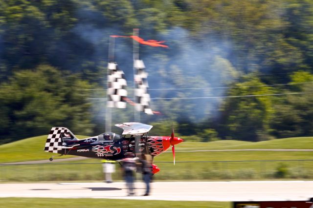 Experimental 100kts (N540SS) - Skip Stewart flying under the ribbons at the Spirit of St Louis Air Show