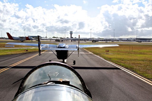 Cessna Super Skymaster (VH-OIQ) - Taxiway Alpha 2, holding short runway one five Cairns. Ready to depart for the Great Barrier Reef with OutbackOvernight.com