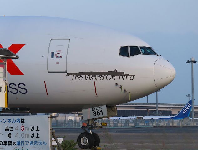 BOEING 777-200LR (N861FD) - Photo taken on Sep 18, 2022.br /Is the black stuff on the nose of the plane peeling paint?