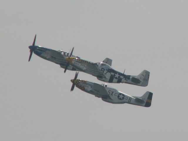 North American P-51 Mustang (N51JB) - at Thunder Over the Boardwalk in Atlantic City, NJ 2009.    The Horsemen aerobatic team.    The yellow checkered one is the P-51 Double Trouble Two NL7TF.    The Blue one is the P-51 Princess Elizabeth NL487FS.    The non checkered yellow P-51 is Bald Eagle N51JB.