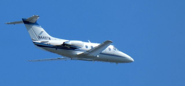 Beechcraft Beechjet (N449TM) - Shortly after departure is this 2008 Hawker Beechcraft 400XP from the Summer of 2024.