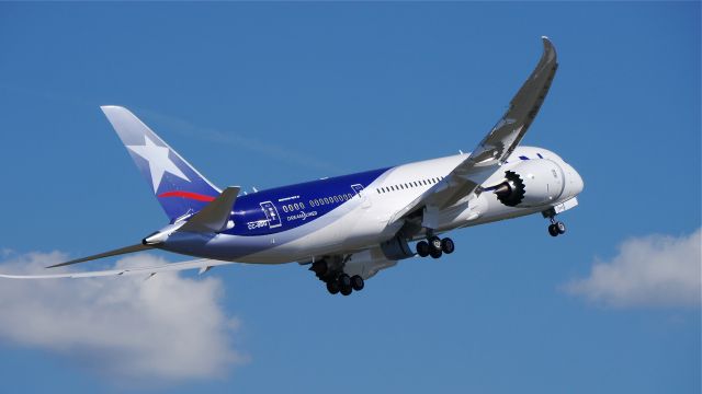 Boeing 787-8 (CC-BBG) - LAN9900 does a wing wave while climbing from Rwy 16R to begin its delivery flight to SCEL / SCL on 8/7/14. (LN:195 / cn 38477).