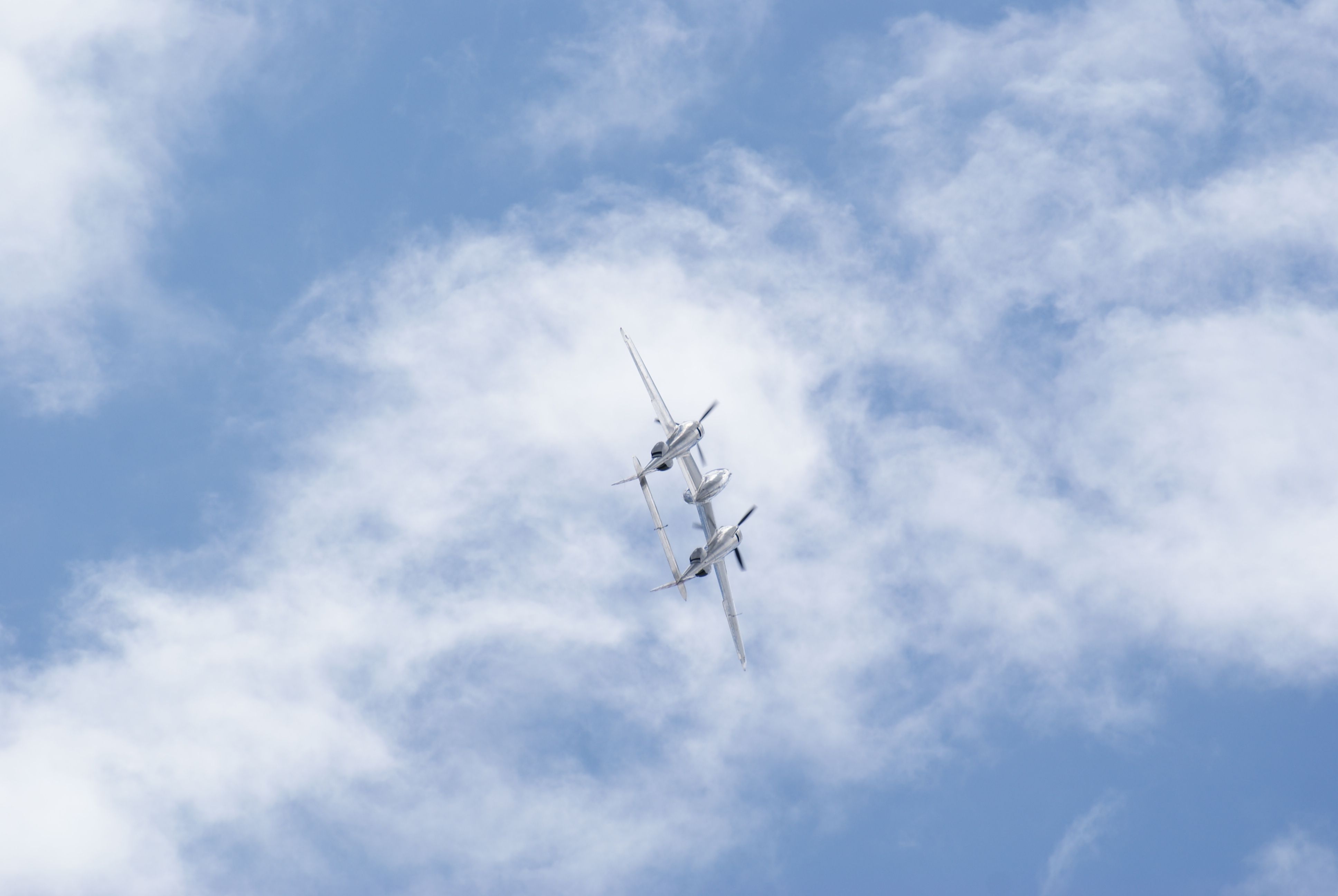 Lockheed P-38 Lightning (N25Y) - The Red Bull Lightning part way thru the barrel roll at Duxford Flying Legends airshow July 12