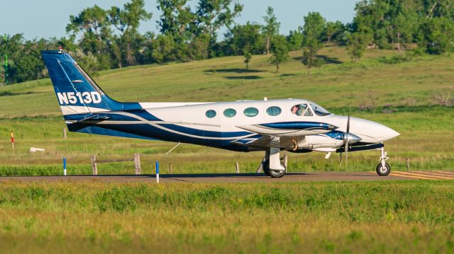 Cessna 340 (N513D) - N513D entering runway 31 at Dunn County Airport.