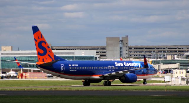 Boeing 737-800 (N815SY) - Taxiing to a terminal is this 2002 Sun Country Airlines Boeing 737-8BK from the Summer of 2020.