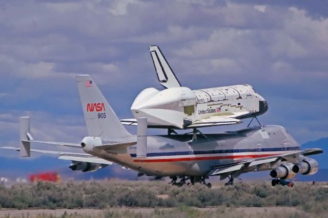 BOEING 747-100 (N905NA) - The Space Shuttle Columbia departed from Runway 04 at Edwards Air Force Base on 747-SCA N905NA on March 20, 1979 on its delivery flight to the Kennedy Space Center. There was still a lot of work to be done on the installation of thermal protection system tiles. The American Airlines heritage of the 747-SCA was still evident.