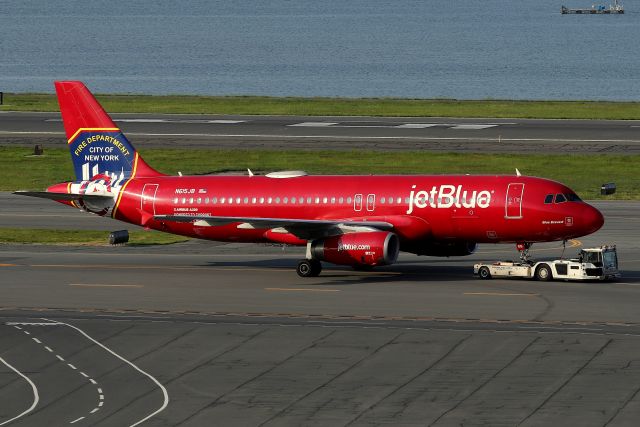 Airbus A320 (N615JB) - 'Blue Bravest' being tugged to the gate   (5/19)