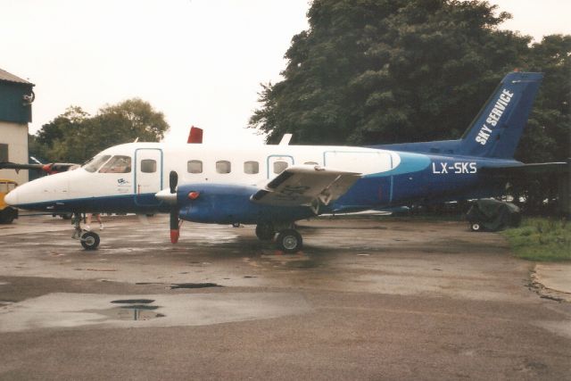 Embraer EMB-110 Bandeirante (LX-SKS) - Seen here in Aug-99.br /br /Reregistered OO-SKW 19-Nov-02,br /then exported to São Tomé & Príncipe 24-Sep-03 as S9-DAI,br /then reregistered 9G-FWC in May-05 for Air Shuttle.