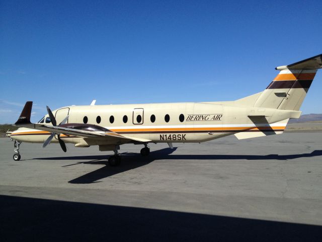 Beechcraft 1900 (N148SK) - Outside Bering Air on the tarmac at Nome Airport.