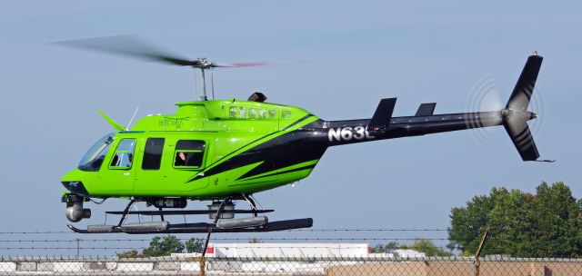 Bell JetRanger (N63L) - LINDEN AIRPORT-LINDEN, NEW JERSEY, USA-OCTOBER 12, 2022: A helicopter owned by Helicopters, Inc was seen by RF taking off shortly after refueling at Linden Airport. Notice the wave of the hand from the rear window, probably belonging to the cameraman.