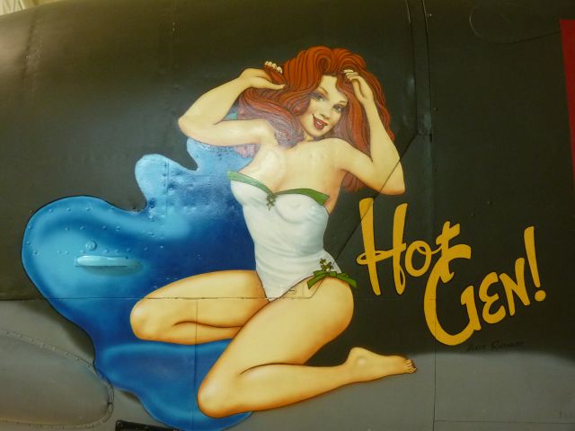 — — - painted on nose of bomber, wow is she "HOT".