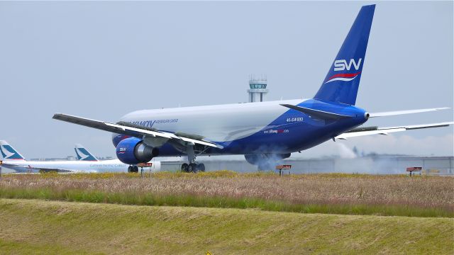 BOEING 767-300 (4K-SW880) - BOE552 makes a fast taxi test on runway 34L on 7/14/12. The pilots must have found a problem as they returned to Boeing parking after the test. The plane is a B767-32LF(ER) (LN:1034).