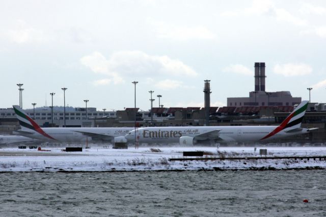 BOEING 777-300ER (A6-ECV) - Emirates B777-300 (A6-ECV) taxis for departure a couple of hours late due to a snow storm, taxis by A6-ECG which arrived from Dubai on 02/13/17. 