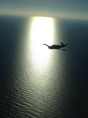 Beechcraft 35 Bonanza (N80YD) - Over the Gulf of Mexico. shot from a Cessna skylark flying from Apalachicola to Crystal River.