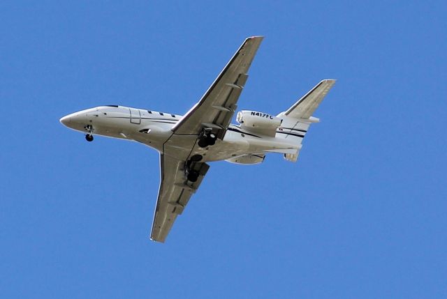 Pilatus PC-24 (N417FC) - Wheels down, making final approach to Orlando International. MCObr /Clear skies, runway in sight.