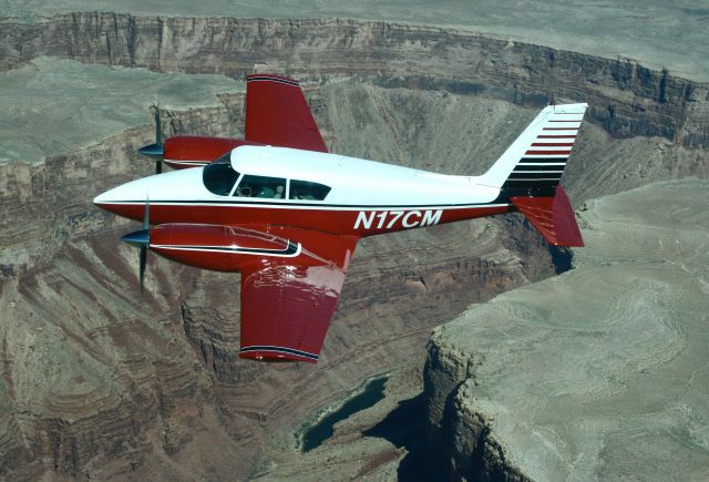 N17CM — - Twin Comanche over the Grand Canyon.