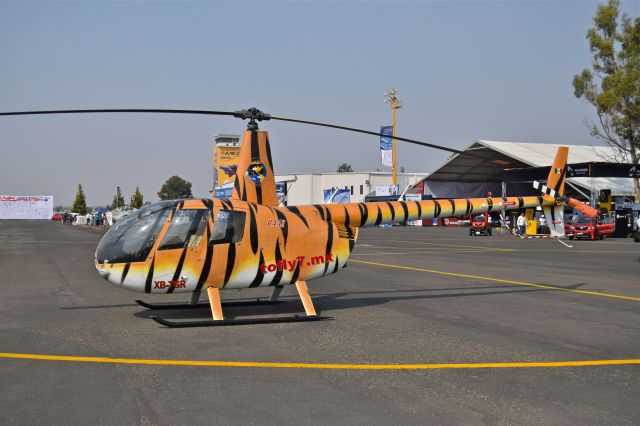 Robinson R-44 (XB-TGR) - Robinson R44 Raven II XB-TGR MSN 12111 of "Tofly7.mx" a company dedicated to special helicopter flights, on display during the open day in trade show "FAMEX 2019" at Santa Lucia AB (04/2019).