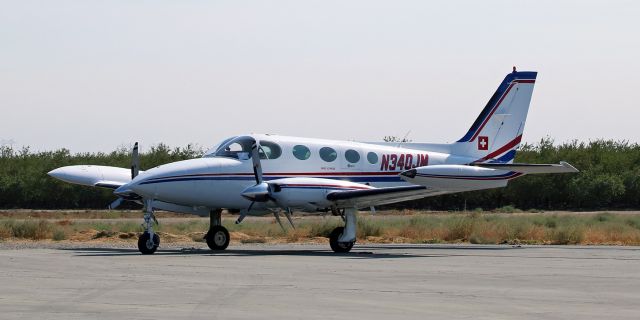 Cessna 340 (N340JM) - Captured while making a brief stop at Harris Ranch Airport (Coalinga, CA), N340JM (nicknamed "Swiss Express") displays a small depiction of the Swiss cross on the tail.  The nickname and the small Swiss cross are both on the Cessna to symbolize the fact that the owner lives in Gonzales, CA, and Gonzales claims a historical connection to Switzerland.