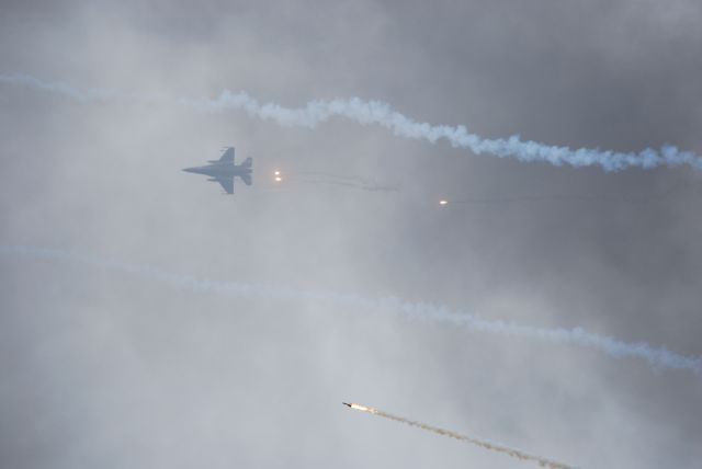 — — - F-16 of the South Carolina Air National Guard 157FS/169FW, the  "Swamp Foxes", popping flares during "airfield assault" during airshow 10-11-2009 at McEntire JNGB . after pics were downloaded I discovered I had also caught the "SAM" being shot at the 16. 