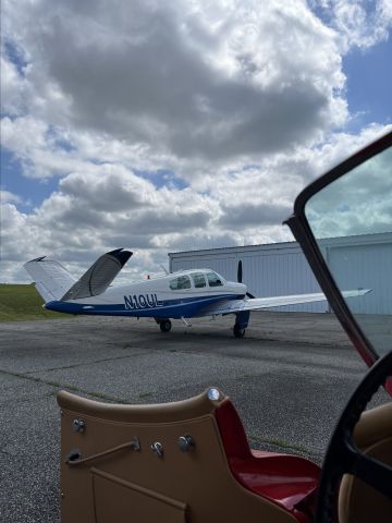 Beechcraft 35 Bonanza (N10UL) - Our airplane took it from fancy car