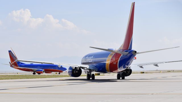 Boeing 737 MAX 8 (N8710M) - Southwest Boeing 737-7H4 (WL) and Boeing 737 MAX 8 taxiing on the ramp at Albuquerque International Sunport, New Mexico