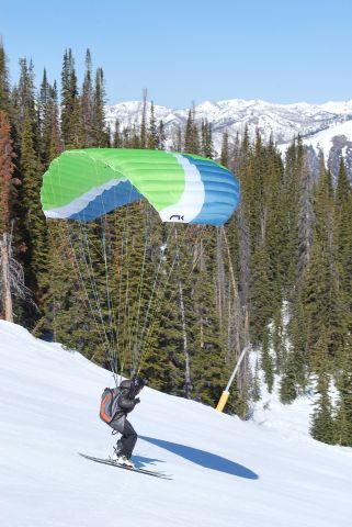 — — - Paraglider taking off from Baldy Ski Hill in Sun Valley, Idaho