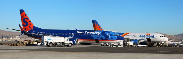 Boeing 737-800 (N820SY) - This is three pictures connected together to make a one-photo panoramic of the two charters that were at RNO to pick up US Marines and transport them to Cherry Point.