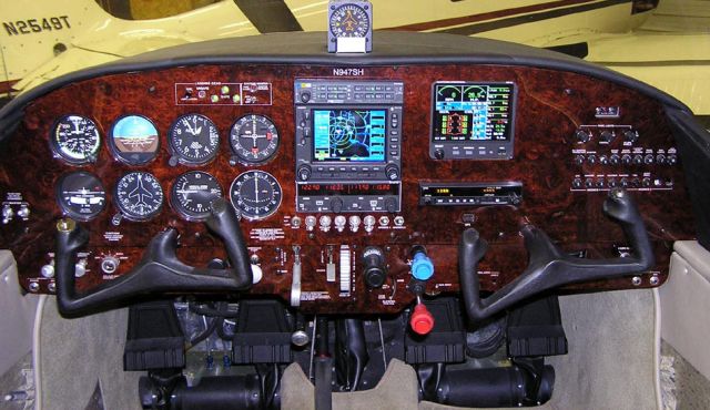 North American Navion (N947SH) - Upgraded burl panel with dove leather interior.     This aircraft was modified and upgraded to the F model version by Sierra Hotel Aero & Navion factory located at KSGS.     Note the E.I. MVP-50 installed on the right side of the panel. The MVP-50 is now STCd for replacement as primary equipment. Sierra Hotel Aero is the leading factory authorized MVP-50 installation center.