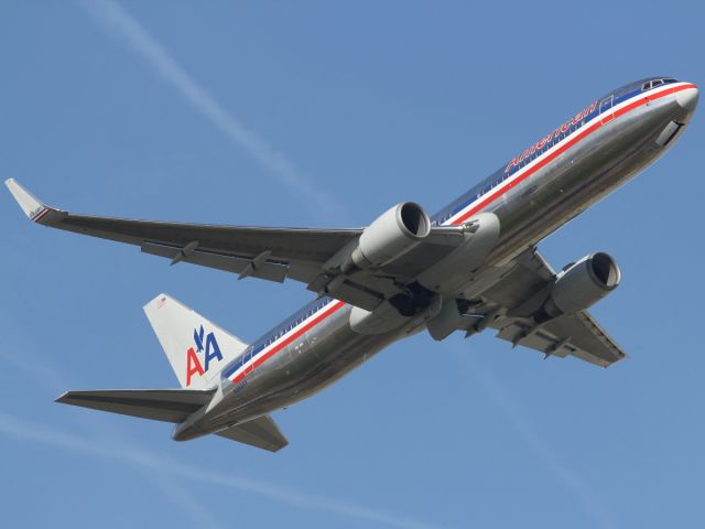 — — - A rare day in London with severe clear conditions. Here an American Airlines B767-300ER departs runway 09R at LHR. She looks great with those winglets.