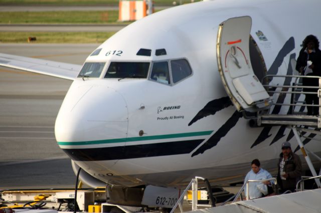 Boeing 737-700 (N612AS) - Parked on ramp at Former Terminal C .. in Boeing colors opposite of passenger door; Note: No jet way available