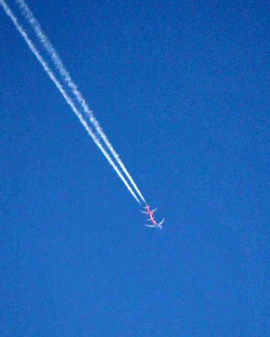 — — - There is only so much you can do with a 200mm lens, but I HAD to try the shot as these two passed over KLAL.