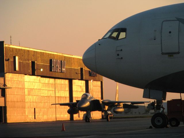 McDonnell Douglas F-15 Eagle — - F-15/B767 at sunset at KRFD. F-15 was one of a flight of four staged at RFD for a fly over at the NASCAR race at the Chicagoland Speedway.